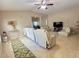 Open-concept living area with a vaulted ceiling, tile floors, and a clear view of the dining space at 7114 Hamilton Park Blvd, Tampa, FL 33615