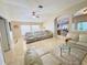 An open living space with tile floors, neutral walls, an easy transition to a breakfast bar and kitchen at 7114 Hamilton Park Blvd, Tampa, FL 33615
