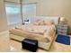 Bedroom featuring tile flooring, window, and a modern bed at 7114 Hamilton Park Blvd, Tampa, FL 33615