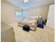 Bright bedroom with neutral tones and tile flooring at 7114 Hamilton Park Blvd, Tampa, FL 33615