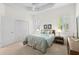 Bedroom with a king bed, tray ceiling, and shutters at 7159 Westhill Ct, Lakewood Ranch, FL 34202