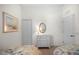 Twin bedroom with neutral walls and decor, including built-in closet and artwork at 7159 Westhill Ct, Lakewood Ranch, FL 34202