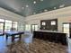 Spacious clubhouse with a pool table, bar, and dining area for residents at 7159 Westhill Ct, Lakewood Ranch, FL 34202