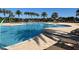 Large community pool with sun loungers and shallow entry, perfect for relaxation at 7159 Westhill Ct, Lakewood Ranch, FL 34202