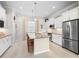 Bright kitchen features stainless appliances, granite counters, and a large island at 7159 Westhill Ct, Lakewood Ranch, FL 34202