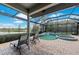 Outdoor patio featuring a pool, spa and a scenic view of the lake and golf course at 7709 Hazeltine Gln, Lakewood Ranch, FL 34202