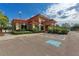 Community building with handicap parking and landscaped surroundings at 7710 Lake Vista Ct # 407, Lakewood Ranch, FL 34202
