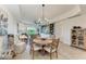 Cozy dining area with a round table and seating for four, adjacent to the living space at 7710 Lake Vista Ct # 407, Lakewood Ranch, FL 34202