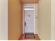 Clean and well-maintained condo entrance featuring a white door, sidelight, and unit number at 7710 Lake Vista Ct # 407, Lakewood Ranch, FL 34202