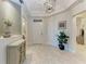 Inviting entryway with neutral decor, stylish accents, and ample storage space at 7710 Lake Vista Ct # 407, Lakewood Ranch, FL 34202