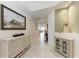 Welcoming entryway with elegant decor, neutral tones, and an open layout to the living area at 7710 Lake Vista Ct # 407, Lakewood Ranch, FL 34202