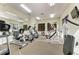 Bright and spacious gym featuring modern exercise equipment and mirrored walls at 7710 Lake Vista Ct # 407, Lakewood Ranch, FL 34202