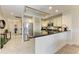 Modern kitchen with stainless steel appliances, granite countertops, and stylish cabinetry at 7710 Lake Vista Ct # 407, Lakewood Ranch, FL 34202