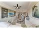 Open concept living room with a view of the dining area, modern decor, and comfortable furnishings at 7710 Lake Vista Ct # 407, Lakewood Ranch, FL 34202