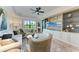 Bright living room with a built-in entertainment center, comfortable seating, and scenic views at 7710 Lake Vista Ct # 407, Lakewood Ranch, FL 34202