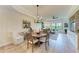 Living room with natural light featuring a dining table and chairs at 7710 Lake Vista Ct # 407, Lakewood Ranch, FL 34202