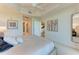 Open view of the main bedroom with ensuite bathroom and walk-in closet access at 7710 Lake Vista Ct # 407, Lakewood Ranch, FL 34202