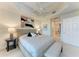 Comfortable main bedroom featuring decor with soft, neutral tones and balcony access at 7710 Lake Vista Ct # 407, Lakewood Ranch, FL 34202