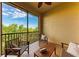 Relaxing screened patio with tiled floors and comfortable seating overlooking lush greenery at 7710 Lake Vista Ct # 407, Lakewood Ranch, FL 34202