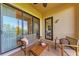 Charming patio with sliding glass doors and comfortable seating, perfect for enjoying the outdoors at 7710 Lake Vista Ct # 407, Lakewood Ranch, FL 34202