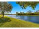 A beautiful backyard featuring water views and lush green grass at 8271 47Th Street E Cir, Palmetto, FL 34221