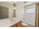 Bathroom featuring a single sink vanity, shower and bathtub combo at 8271 47Th Street E Cir, Palmetto, FL 34221