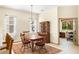 Dining area next to kitchen with natural lighting, adjacent office and furniture at 8271 47Th Street E Cir, Palmetto, FL 34221