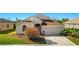Charming single-Gathering home with manicured lawn, mature bushes, and attached two car garage at 8271 47Th Street E Cir, Palmetto, FL 34221