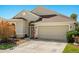 Charming single-story home featuring a two-car garage, neutral paint, and well-maintained landscaping at 8271 47Th Street E Cir, Palmetto, FL 34221