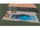 A luxurious pool with seating areas and a covered patio, perfect for outdoor relaxation and entertainment at 9410 Bluefin Ter, Bradenton, FL 34209