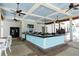 Open-air pool bar area with light blue facade and dark granite countertops near the pool at 10072 Cozy Grove Dr, Venice, FL 34293