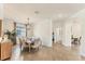 Elegant dining room with stylish chandelier, and view into the living area at 10072 Cozy Grove Dr, Venice, FL 34293