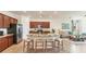 Modern kitchen with granite countertops, stainless steel appliances and breakfast bar seating at 10072 Cozy Grove Dr, Venice, FL 34293