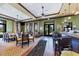 Well-lit restaurant featuring tables, chairs, bar with stools, and large windows at 10072 Cozy Grove Dr, Venice, FL 34293