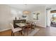 Cozy dining room with stylish furnishings, natural light, and easy access to the outdoor area at 1021 Ancora Blvd, North Venice, FL 34275