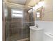 Bathroom featuring glass enclosed shower, white vanity, and neutral tile throughout at 108 Martin Ne Dr, Port Charlotte, FL 33952