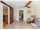 Bonus space featuring hardwood floors, barn door, and comfortable seating at 108 Martin Ne Dr, Port Charlotte, FL 33952