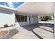 A carport with a painted concrete floor, perfect for parking and entertaining at 108 Martin Ne Dr, Port Charlotte, FL 33952