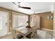 Dining room featuring neutral colors, wood floors, and ceiling fan at 108 Martin Ne Dr, Port Charlotte, FL 33952