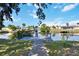 Scenic view of a backyard canal with a wooden dock perfect for boating and enjoying waterfront living at 108 Martin Ne Dr, Port Charlotte, FL 33952