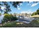 Beautiful backyard canal view with a private boat dock for easy water access and scenic enjoyment at 108 Martin Ne Dr, Port Charlotte, FL 33952