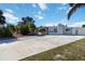 Extra large concrete driveway leads to the covered carport of this single Gathering home at 108 Martin Ne Dr, Port Charlotte, FL 33952