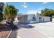 Charming home with a carport, nicely landscaped yard, and a well-maintained exterior at 108 Martin Ne Dr, Port Charlotte, FL 33952