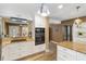 Updated kitchen boasts granite countertops, stainless appliances and sleek, white cabinetry at 108 Martin Ne Dr, Port Charlotte, FL 33952
