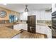 Modern kitchen featuring granite countertops, stainless steel appliances and beautiful cabinetry at 108 Martin Ne Dr, Port Charlotte, FL 33952