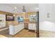 Open kitchen with granite countertops, modern white cabinets and stainless appliances at 108 Martin Ne Dr, Port Charlotte, FL 33952