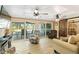 Spacious living room with bright lighting, comfortable seating, access to the lanai and sliding barn doors at 108 Martin Ne Dr, Port Charlotte, FL 33952