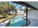 Backyard oasis featuring a pool with screen enclosure for year-round enjoyment and privacy at 108 Martin Ne Dr, Port Charlotte, FL 33952