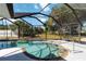 Sparkling pool with a screen enclosure provides a relaxing outdoor space for swimming and entertaining at 108 Martin Ne Dr, Port Charlotte, FL 33952