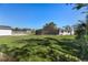 The spacious backyard boasts a screened pool, shed, and lush greenery at 11 1St E St, Nokomis, FL 34275